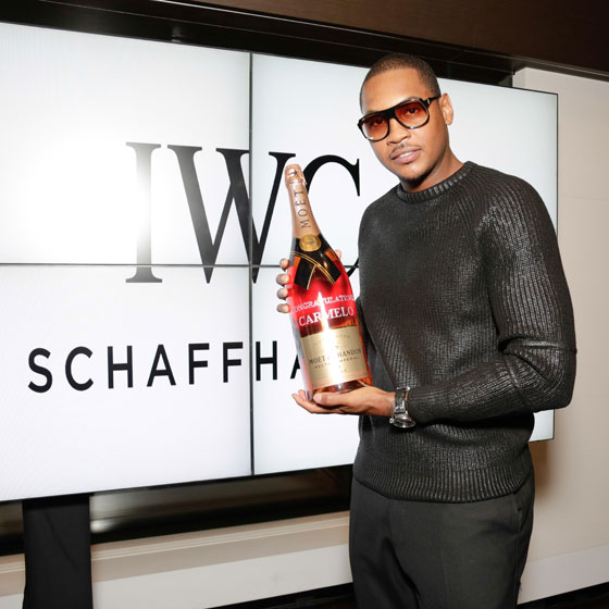 Carmelo-is-presented-with-a-crystalized-bottle-of-Moet-Chandon